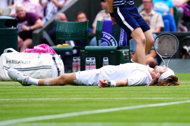 Mandatory Credit: Photo by Javier Garcia Shutterstock (14003753is) Andrey Rublev falls during his quarter final match Wimbledon Tennis Championships, Day 9, The All England Lawn Tennis and Croquet Club, London, UK - 11 Jul 2023 Wimbledon Tennis Championships, Day 9, The All England Lawn Tennis and Croquet Club, London, UK - 11 Jul 2023  Copyright: xJavierxGarcia Shutterstockx 14003753is