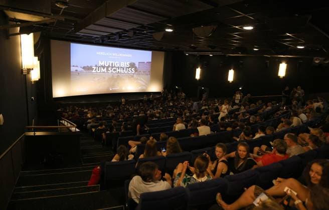 11 07 2023 football season 2022 2023 2 women football Bundesliga cinema premiere 1 FC Nürnberg FCN club promotion film brave to the end sports photo zinc DaMa xdaxmax symbol picture symbol photo feature impression audience fans club fan club fans FCN fans fans in the cinema hall cinema