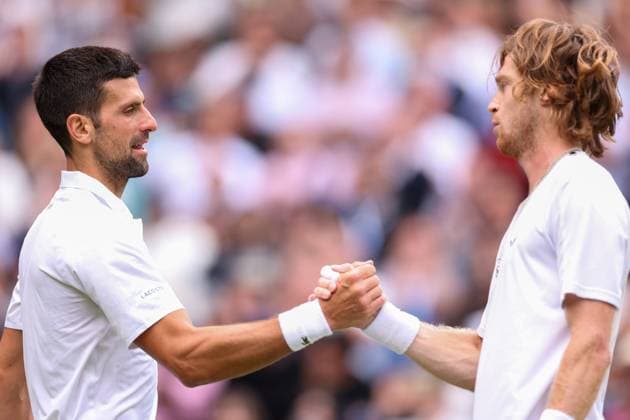 11th July 2023; All England Lawn Tennis and Croquet Club, London, England: Wimbledon Tennis Tournament; Novak Djokovic shakes hands with Andrey Rublev after he wins the mens quarter-final match  ActionPlus12530333 ShaunxBrooks
