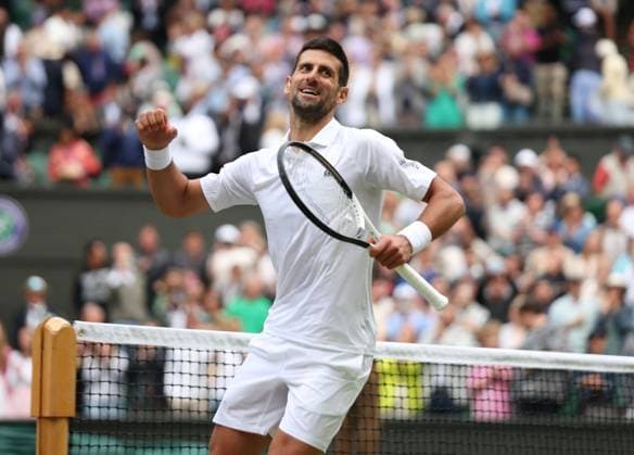 Serbian Novak Djokovicc celebrates victory in his Men s Quarter-Final match against Russian Andrey Rublev at the 2023 Wimbledon championships in London on Tuesday, July 11, 2023.  LON2023071185 HUGOxPHILPOTT