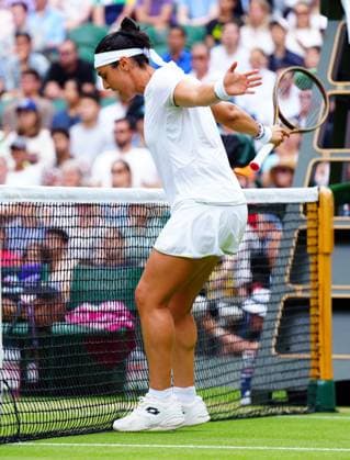 Mandatory Credit: Photo by Javier Garcia Shutterstock (14006839al) Ons Jabeur avoids the net during her quarter final match Wimbledon Tennis Championships, Day 10, The All England Lawn Tennis and Croquet Club, London, UK - 12 Jul 2023 Wimbledon Tennis Championships, Day 10, The All England Lawn Tennis and Croquet Club, London, UK - 12 Jul 2023  Copyright: xJavierxGarcia Shutterstockx 14006839al