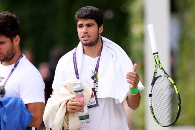 12th July 2023; All England Lawn Tennis and Croquet Club, London, England: Wimbledon Tennis Tournament; Carlos Alcaraz walks to the practice courts  ActionPlus12530490 ShaunxBrooks