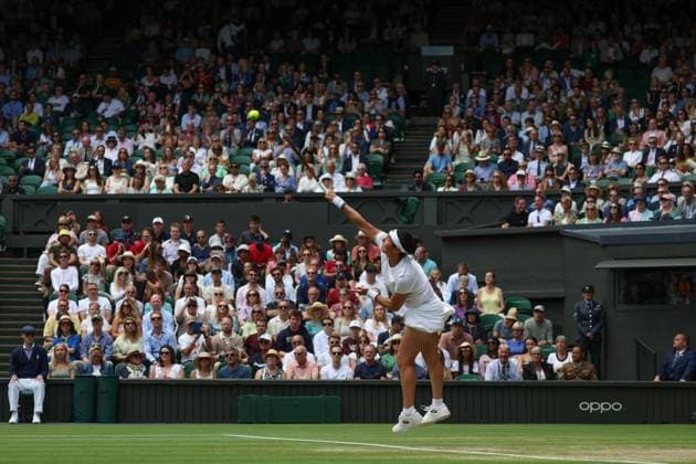12th July 2023; All England Lawn Tennis and Croquet Club, London, England: Wimbledon Tennis Tournament; Ons Jabeur (TUN) serves to Elena Rybakina (KAZ)  ActionPlus12530603 JohnxPatrickxFletcher