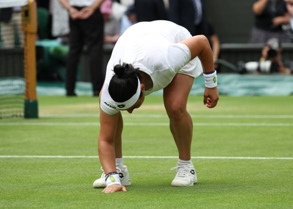 12th July 2023; All England Lawn Tennis and Croquet Club, London, England: Wimbledon Tennis Tournament; Ons Jabeur (TUN) celebrates by kissing the court after defeating the defending champion Elena Rybakina (KAZ) by two sets to one  ActionPlus12530692 JohnxPatrickxFletcher