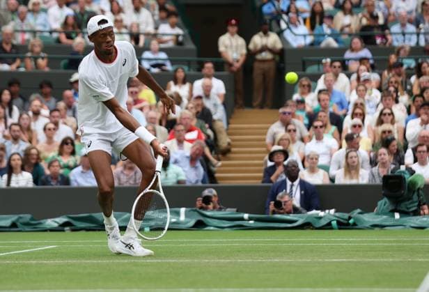 American Christopher Eubanks plays a drop shot in his Men s Quarter-Final match against Russian Daniil Medvedev at the 2023 Wimbledon championships in London on Wednesday, July 12, 2023.  LON2023071239 HUGOxPHILPOTT