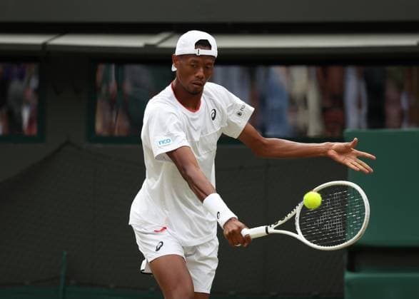 12th July 2023; All England Lawn Tennis and Croquet Club, London, England: Wimbledon Tennis Tournament; Christopher& xa0;Eubanks (USA) with a backhand shot to Daniil& xa0;Medvedev (RUS)  ActionPlus12530794 JohnxPatrickxFletcher