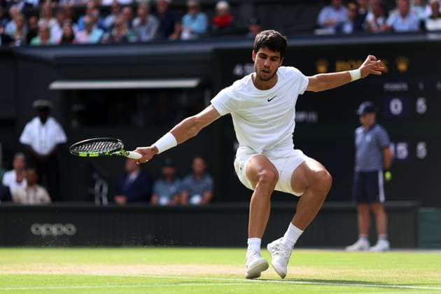 12th July 2023; All England Lawn Tennis and Croquet Club, London, England: Wimbledon Tennis Tournament; Carlos Alcaraz plays a backhand shot to Holger Rune  ActionPlus12530855 ShaunxBrooks