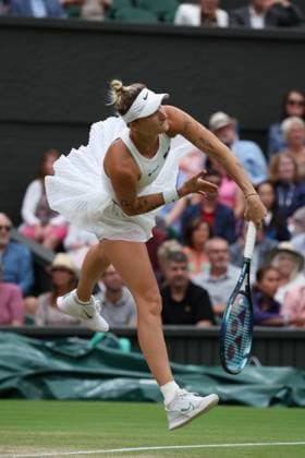 13th July 2023; All England Lawn Tennis and Croquet Club, London, England: Wimbledon Tennis Tournament; Marketa Vondrousova (CZE) serves to Elina Svitolina (UKR) , womens singles semi-final match  ActionPlus12531078 JohnxPatrickxFletcher