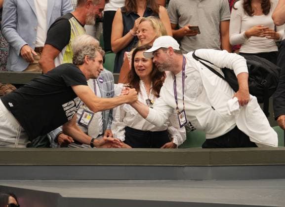 Tennis - 2023 Wimbledon Championships - Week Two - Day Eleven - All England lawn Tennis & Racquet Club, Wimbledon - Thursday 13th Ladies singles semi final Elina Svitolina (UKR) v Marketa Vondrousova (CZE) Marketa Vondrousova coach is congratulated by the coach of Elina Svitolina 
