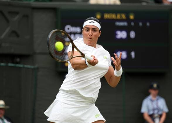 13th July 2023; All England Lawn Tennis and Croquet Club, London, England: Wimbledon Tennis Tournament; Ons Jabeur (TUN) with a forehand shot to Aryna Sabalenka (BLR)  ActionPlus12531096 JohnxPatrickxFletcher