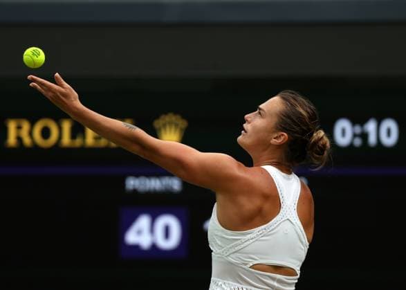 13th July 2023; All England Lawn Tennis and Croquet Club, London, England: Wimbledon Tennis Tournament; Aryna Sabalenka (BLR) serves to Ons Jabeur (TUN)  ActionPlus12531105 JohnxPatrickxFletcher
