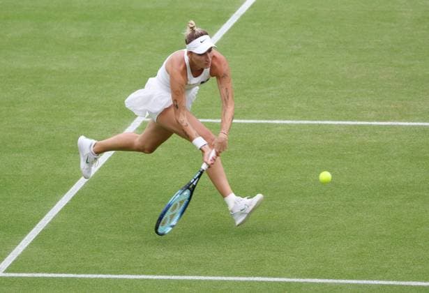 Czech Marketa Vondrousova plays a backhand in her Women s semifinals match against Ukraine s Elina Svitolina at the 2023 Wimbledon championships in London on Thurssday, July 13, 2023. Vondrousova won the match 6-3,6-3.  LON2023071318 HUGOxPHILPOTT