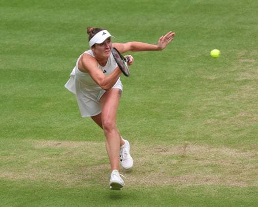 Ukraine s Elina Svitolina plays a forehand in her Women s semifinals match against Czech Marketa Vondrousova at the 2023 Wimbledon championships in London on Thurssday, July 13, 2023. Vondrousova won the match 6-3,6-3.  LON2023071320 HUGOxPHILPOTT