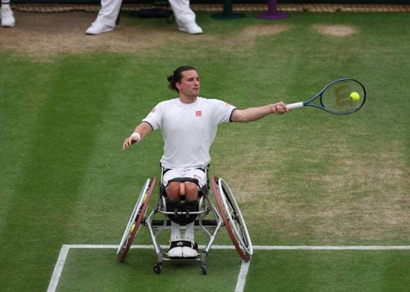 13th July 2023; All England Lawn Tennis and Croquet Club, London, England: Wimbledon Tennis Tournament; Gordon Reid (GBR) with a forehand shot to Martin De La Puente (ESP) during the mens wheelchair doubles semi-final  ActionPlus12531130 JohnxPatrickxFletcher