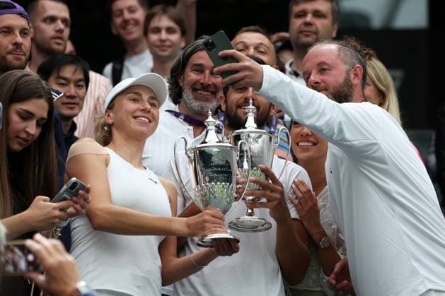 13th July 2023; All England Lawn Tennis and Croquet Club, London, England: Wimbledon Tennis Tournament; Lyudmyla& xa0;Kichenok (UKR) and Mate& xa0;Pavic (CRO) pose with their Mixed Doubles Trophy alongside their coaches  ActionPlus12531153 JohnxPatrickxFletcher