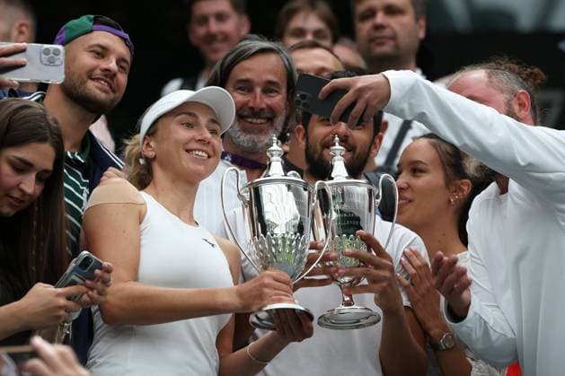 13th July 2023; All England Lawn Tennis and Croquet Club, London, England: Wimbledon Tennis Tournament; Lyudmyla& xa0;Kichenok (UKR) and Mate& xa0;Pavic (CRO) pose with their Mixed Doubles Trophy alongside their coaches  ActionPlus12531154 JohnxPatrickxFletcher