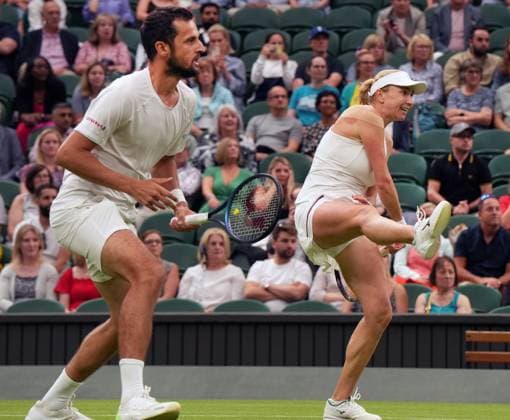 Tennis - 2023 Wimbledon Championships - Week Two - Day Eleven - All England lawn Tennis & Racquet Club, Wimbledon - Thursday 13th Mixed Doubles final Mate Pavings (CRO) and Lyudmyia Kirchenok (UKR) V Joran Vliegen (BEL) v Yifan Xu (CHN) Lyudmyia Kirchenok (UKR) smashes the winning shot in the 3rd set 