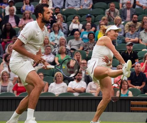 Tennis - 2023 Wimbledon Championships - Week Two - Day Eleven - All England lawn Tennis & Racquet Club, Wimbledon - Thursday 13th Mixed Doubles final Mate Pavings (CRO) and Lyudmyia Kirchenok (UKR) V Joran Vliegen (BEL) v Yifan Xu (CHN) Lyudmyia Kirchenok (UKR) smashes the winning shot in the 3rd set 