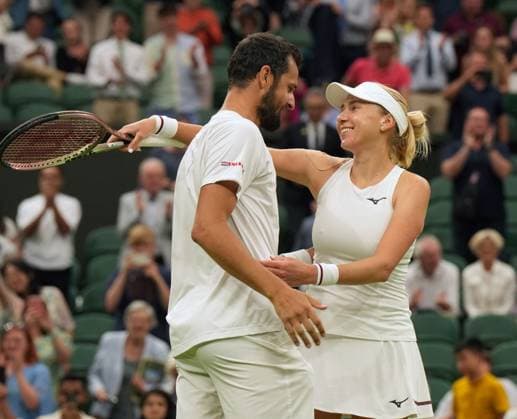 Tennis - 2023 Wimbledon Championships - Week Two - Day Eleven - All England lawn Tennis & Racquet Club, Wimbledon - Thursday 13th Mixed Doubles final Mate Pavings (CRO) and Lyudmyia Kirchenok (UKR) V Joran Vliegen (BEL) v Yifan Xu (CHN) Winners Mate Pavings (CRO) and Lyudmyia Kirchenok (UKR) celebrate winning match point 