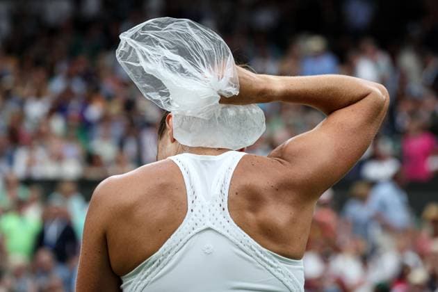 13th July 2023; All England Lawn Tennis and Croquet Club, London, England: Wimbledon Tennis Tournament; Aryna Sabalenka (BLR) puts an ice pack on her neck during a break in play  ActionPlus12531166 JohnxPatrickxFletcher