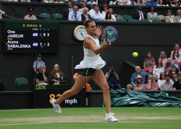 13th July 2023; All England Lawn Tennis and Croquet Club, London, England: Wimbledon Tennis Tournament; Aryna Sabalenka (BLR) with a forehand shot to Ons Jabeur (TUN)  ActionPlus12531179 JohnxPatrickxFletcher