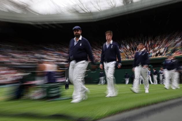 13th July 2023; All England Lawn Tennis and Croquet Club, London, England: Wimbledon Tennis Tournament; New line judges walk onto Centre Court in the Ons Jabeur (TUN) versus Aryna Sabalenka (BLR) match captured using a slow shutter effect  ActionPlus12531183 JohnxPatrickxFletcher