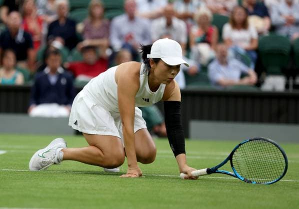 (230714) -- LONDON, July 14, 2023 -- Xu Yifan competes during the mixed doubles final match between Xu Yifan of China Joran Vliegen of Belgium and Mate Pavic of Croatia Lyudmyla Kichenok of Ukraine at Wimbledon tennis Championship in London, Britain, on July 13, 2023. ) (SP)BRITAIN-LONDON-TENNIS-WIMBLEDON-DAY 11 LixYing 