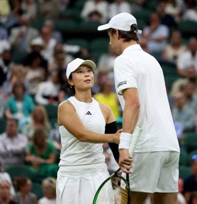 (230714) -- LONDON, July 14, 2023 -- Xu Yifan (L) Joran Vliegen react during the mixed doubles final match between Xu Yifan of China Joran Vliegen of Belgium and Mate Pavic of Croatia Lyudmyla Kichenok of Ukraine at Wimbledon tennis Championship in London, Britain, on July 13, 2023. ) (SP)BRITAIN-LONDON-TENNIS-WIMBLEDON-DAY 11 LixYing 