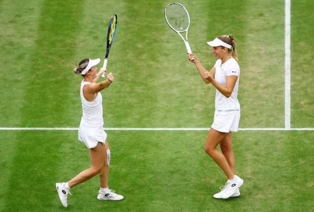 Mandatory Credit: Photo by Kieran McManus Shutterstock (14009604ab) Elise Mertens of Belgium and Storm Hunter of Australia celebrate winning their Ladies Doubles Semi Final match. Wimbledon Tennis Championships, Day 12, The All England Lawn Tennis and Croquet Club, London, UK - 14 Jul 2023 Wimbledon Tennis Championships, Day 12, The All England Lawn Tennis and Croquet Club, London, UK - 14 Jul 2023  Copyright: xKieranxMcManus Shutterstockx 14009604ab