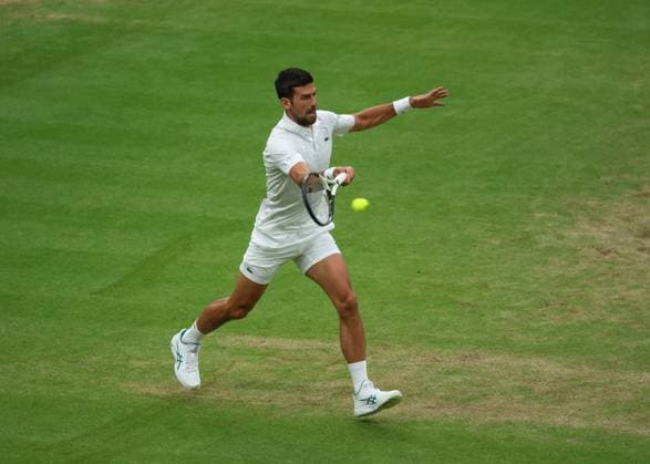 14th July 2023; All England Lawn Tennis and Croquet Club, London, England: Wimbledon Tennis Tournament; Novak Djokovic (GBR) with a forehand shot to Jannik Sinner (ITA)  ActionPlus12531216 JohnxPatrickxFletcher