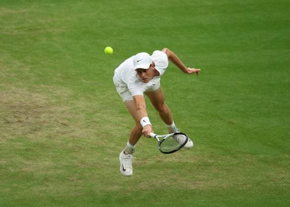 14th July 2023; All England Lawn Tennis and Croquet Club, London, England: Wimbledon Tennis Tournament; Jannik Sinner (ITA) with a backhand shot to Novak Djokovic (SRB)  ActionPlus12531222 JohnxPatrickxFletcher