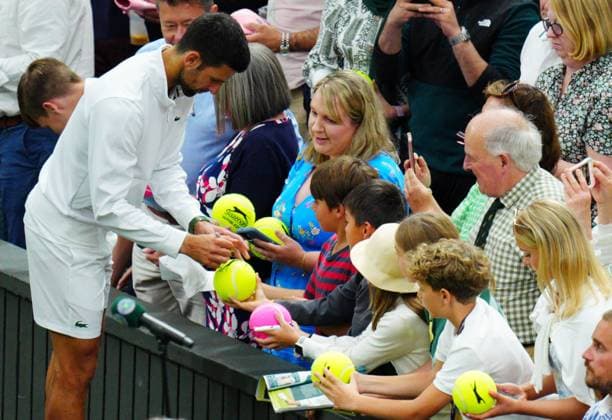 Mandatory Credit: Photo by Javier Garcia Shutterstock (14009601dc) Novak Djokovic celebrates victory in his semi final match and signs autographs Wimbledon Tennis Championships, Day 12, The All England Lawn Tennis and Croquet Club, London, UK - 14 Jul 2023 Wimbledon Tennis Championships, Day 12, The All England Lawn Tennis and Croquet Club, London, UK - 14 Jul 2023  Copyright: xJavierxGarcia Shutterstockx 14009601dc