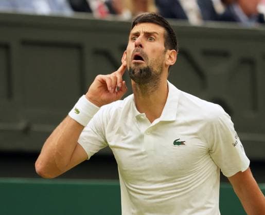 Tennis - 2023 Wimbledon Championships - Week Two - Day Twelve - All England lawn Tennis & Racquet Club, Wimbledon - Friday 14th Mens Semi final - Novak Djokovic v Jannik Sinner Novak Djokovic taunts the crowd after some started booing him 