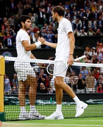 Mandatory Credit: Photo by Kieran McManus Shutterstock (14009604fq) Carlos Alcaraz of Spain and Daniil Medvedev of Russia shake hands after their Semi Final match. Wimbledon Tennis Championships, Day 12, The All England Lawn Tennis and Croquet Club, London, UK - 14 Jul 2023 Wimbledon Tennis Championships, Day 12, The All England Lawn Tennis and Croquet Club, London, UK - 14 Jul 2023  Copyright: xKieranxMcManus Shutterstockx 14009604fq