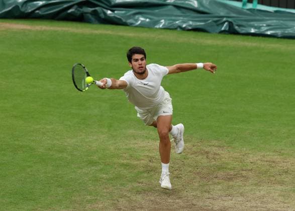 14th July 2023; All England Lawn Tennis and Croquet Club, London, England: Wimbledon Tennis Tournament; Carlos Alcaraz (ESP) with a forehand shot to Daniil Medvedev (RUS)  ActionPlus12531314 JohnxPatrickxFletcher
