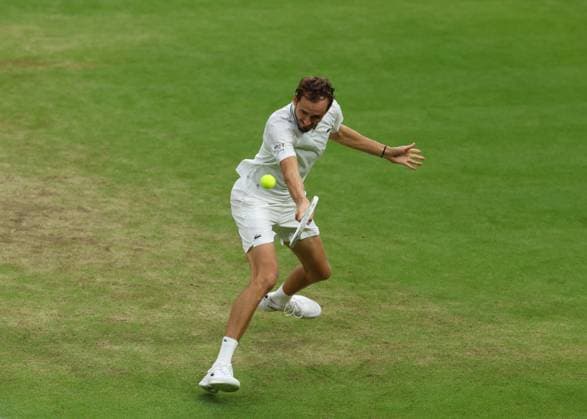 14th July 2023; All England Lawn Tennis and Croquet Club, London, England: Wimbledon Tennis Tournament; Daniil Medvedev (RUS) with a backhand shot to Carlos Alcaraz (ESP)  ActionPlus12531323 JohnxPatrickxFletcher