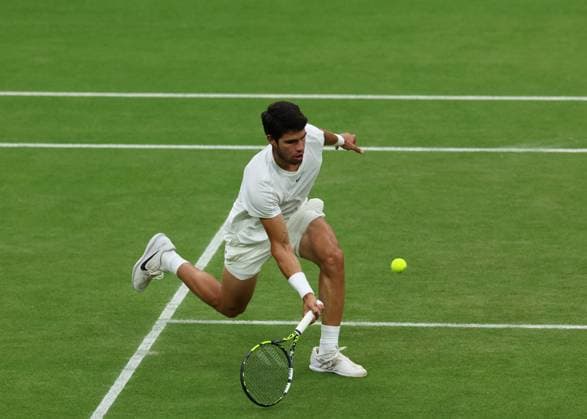 14th July 2023; All England Lawn Tennis and Croquet Club, London, England: Wimbledon Tennis Tournament; Carlos Alcaraz (ESP) with a forehand shot to Daniil Medvedev (RUS)  ActionPlus12531329 JohnxPatrickxFletcher