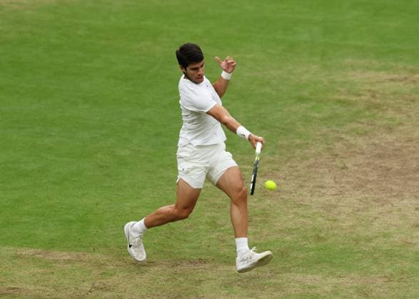 14th July 2023; All England Lawn Tennis and Croquet Club, London, England: Wimbledon Tennis Tournament; Carlos Alcaraz (ESP) with a forehand shot to Daniil Medvedev (RUS)  ActionPlus12531336 JohnxPatrickxFletcher