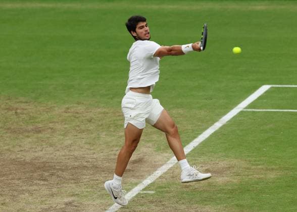 14th July 2023; All England Lawn Tennis and Croquet Club, London, England: Wimbledon Tennis Tournament; Carlos Alcaraz (ESP) with a forehand shot to Daniil Medvedev (RUS)  ActionPlus12531338 JohnxPatrickxFletcher
