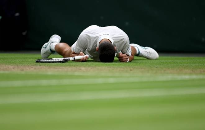 (230715) -- LONDON, July 15, 2023 -- Novak Djokovic reacts during the men s singles semifinal between Novak Djokovic of Serbia and Jannik Sinner of Italy at Wimbledon tennis Championship in London, Britain, on July 14, 2023. ) (SP)BRITAIN-LONDON-TENNIS-WIMBLEDON-DAY 12 LixYing 