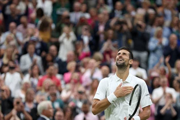 (230715) -- LONDON, July 15, 2023 -- Novak Djokovic celebrates after the men s singles semifinal between Novak Djokovic of Serbia and Jannik Sinner of Italy at Wimbledon tennis Championship in London, Britain, on July 14, 2023. ) (SP)BRITAIN-LONDON-TENNIS-WIMBLEDON-DAY 12 LixYing 