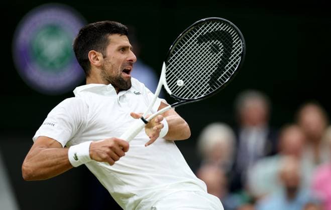 (230715) -- LONDON, July 15, 2023 -- Novak Djokovic competes during the men s singles semifinal between Novak Djokovic of Serbia and Jannik Sinner of Italy at Wimbledon tennis Championship in London, Britain, on July 14, 2023. ) (SP)BRITAIN-LONDON-TENNIS-WIMBLEDON-DAY 12 LixYing 