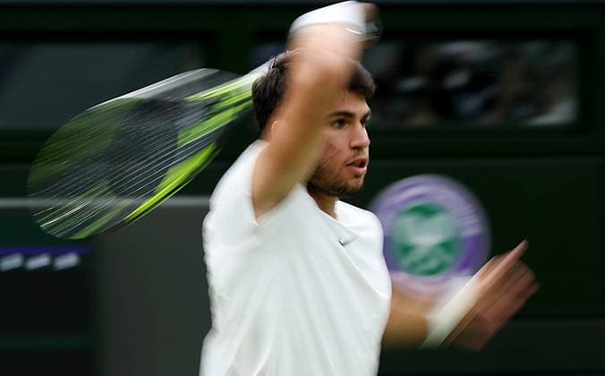 (230715) -- LONDON, July 15, 2023 -- Spain s Carlos Alcaraz competes during the men s singles semifinal against Russia s Daniil Medvedev at Wimbledon tennis Championship in London, Britain, on July 14, 2023. ) (SP)BRITAIN-LONDON-TENNIS-WIMBLEDON-DAY 12 LixYing 