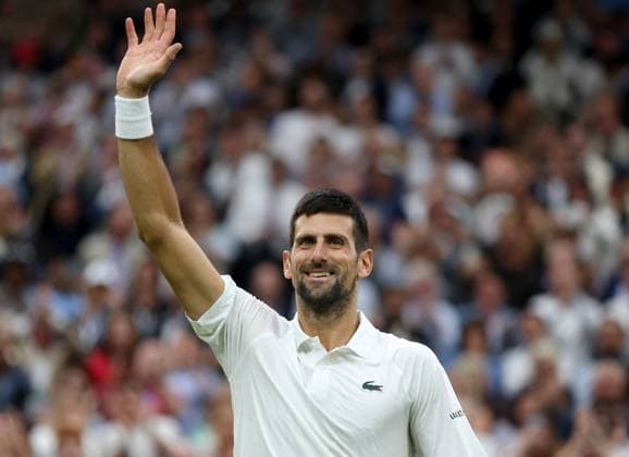 (230715) -- LONDON, July 15, 2023 -- Novak Djokovic celebrates after the men s singles semifinal between Novak Djokovic of Serbia and Jannik Sinner of Italy at Wimbledon tennis Championship in London, Britain, on July 14, 2023. ) (SP)BRITAIN-LONDON-TENNIS-WIMBLEDON-DAY 12 LixYing 