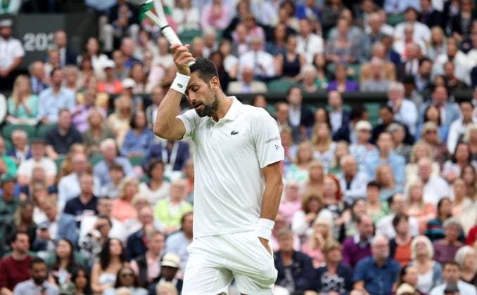 (230715) -- LONDON, July 15, 2023 -- Novak Djokovic reacts during the men s singles semifinal between Novak Djokovic of Serbia and Jannik Sinner of Italy at Wimbledon tennis Championship in London, Britain, on July 14, 2023. ) (SP)BRITAIN-LONDON-TENNIS-WIMBLEDON-DAY 12 LixYing 