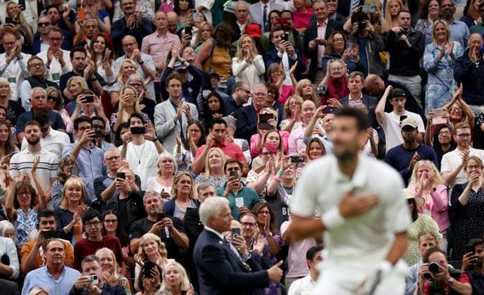 (230715) -- LONDON, July 15, 2023 -- Spectators cheer during the men s singles semifinal between Novak Djokovic of Serbia and Jannik Sinner of Italy at Wimbledon tennis Championship in London, Britain, on July 14, 2023. ) (SP)BRITAIN-LONDON-TENNIS-WIMBLEDON-DAY 12 LixYing 