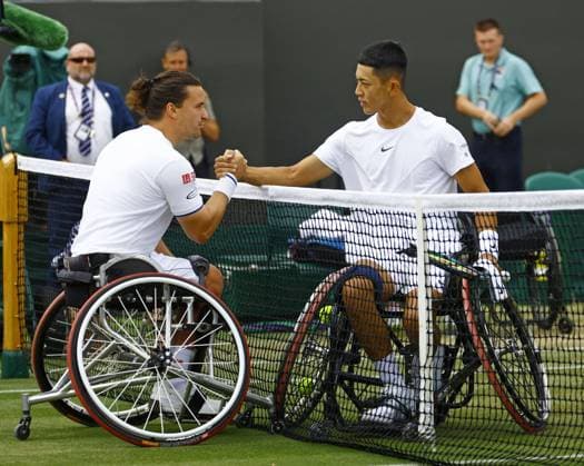 Tennis: Wimbledon championships Tokito Oda (R) of Japan shakes hands with Gordon Reid of Britain after beating him in the men s wheelchair singles semifinals at the Wimbledon tennis tournament in London on July 15, 2023.  A14AA0001683250P  