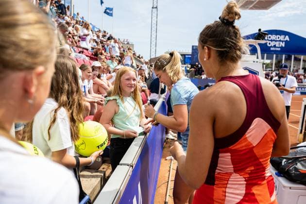 230715 Irina Khromacheva of Russia and Panna Udvardy of Hungary sign autographs after the womens doubles final on day 6 of the WTA Nordea Open on July 15, 2023 in Bastad, Sweden.  Copyright: NICLASxJÖNSSON BB230715NO031