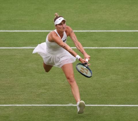 Czech Marketa Vondrousova plays a backhand in her Women s Final match against Tunisian Ons Jabeur at the 2023 Wimbledon championships in London on Saturday, July 15, 2023. Vondrousova won the match 6-4,6-4.  LON2023071504 HUGOxPHILPOTT