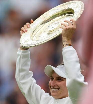 (230716) -- LONDON, July 16, 2023 -- Marketa Vondrousova poses with her trophy after winning the women s singles final match between Marketa Vondrousova of the Czech Republic and Ons Jabeur of Tunisia at Wimbledon Tennis Championships in London, Britain, July 15, 2023. ) (SP)BRITAIN-LONDON-TENNIS-WIMBLEDON-WOMEN S SINGLES-FINAL HanxYan 